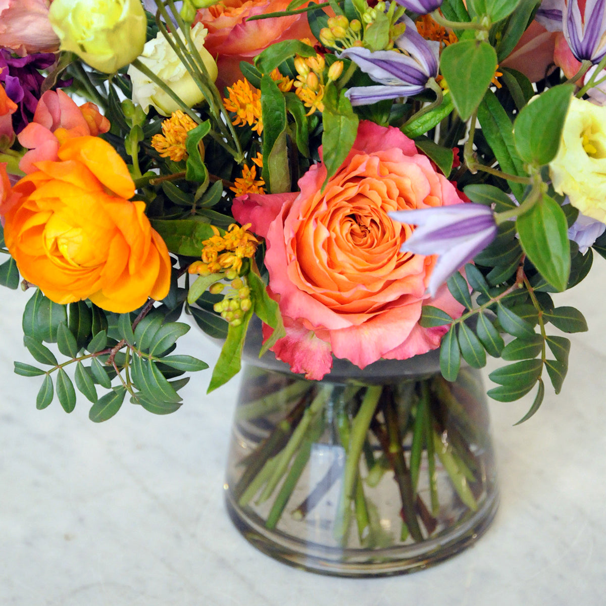 Detail view showing smoked glass compote style vase