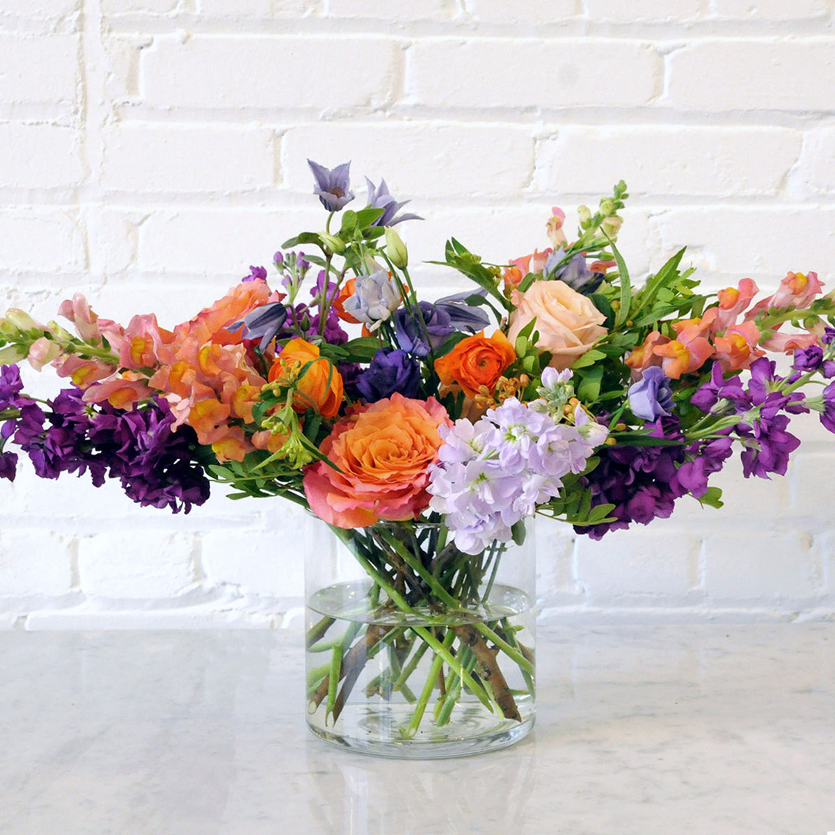 Glass vase with Channing Floral arrangement
