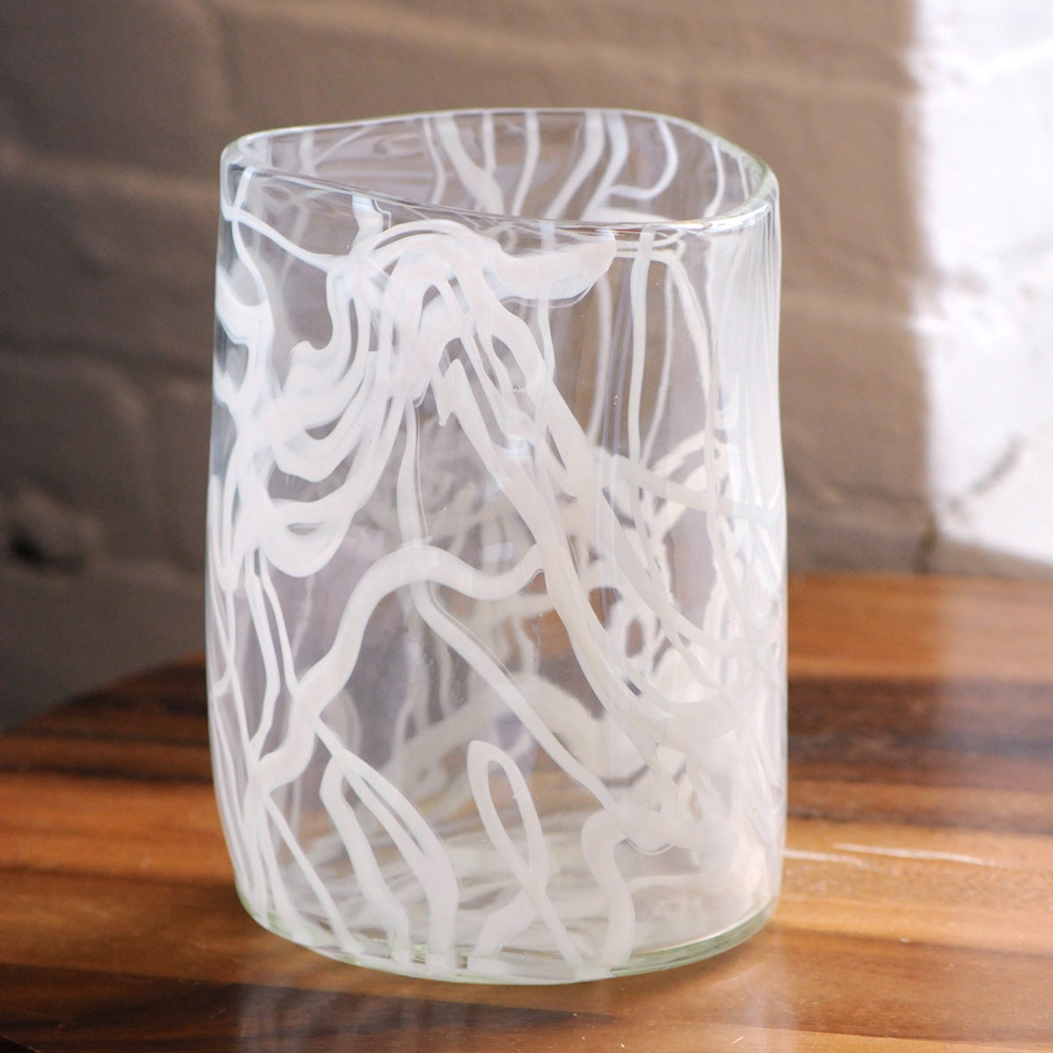 Cirrus Vase on wood table showing triangular shape