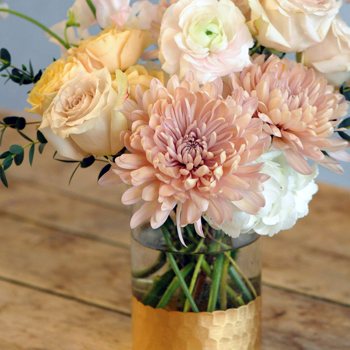 Close up of Peach cremon Chrysanthemums that are in the Spruce Flowers France Ave floral bouquet