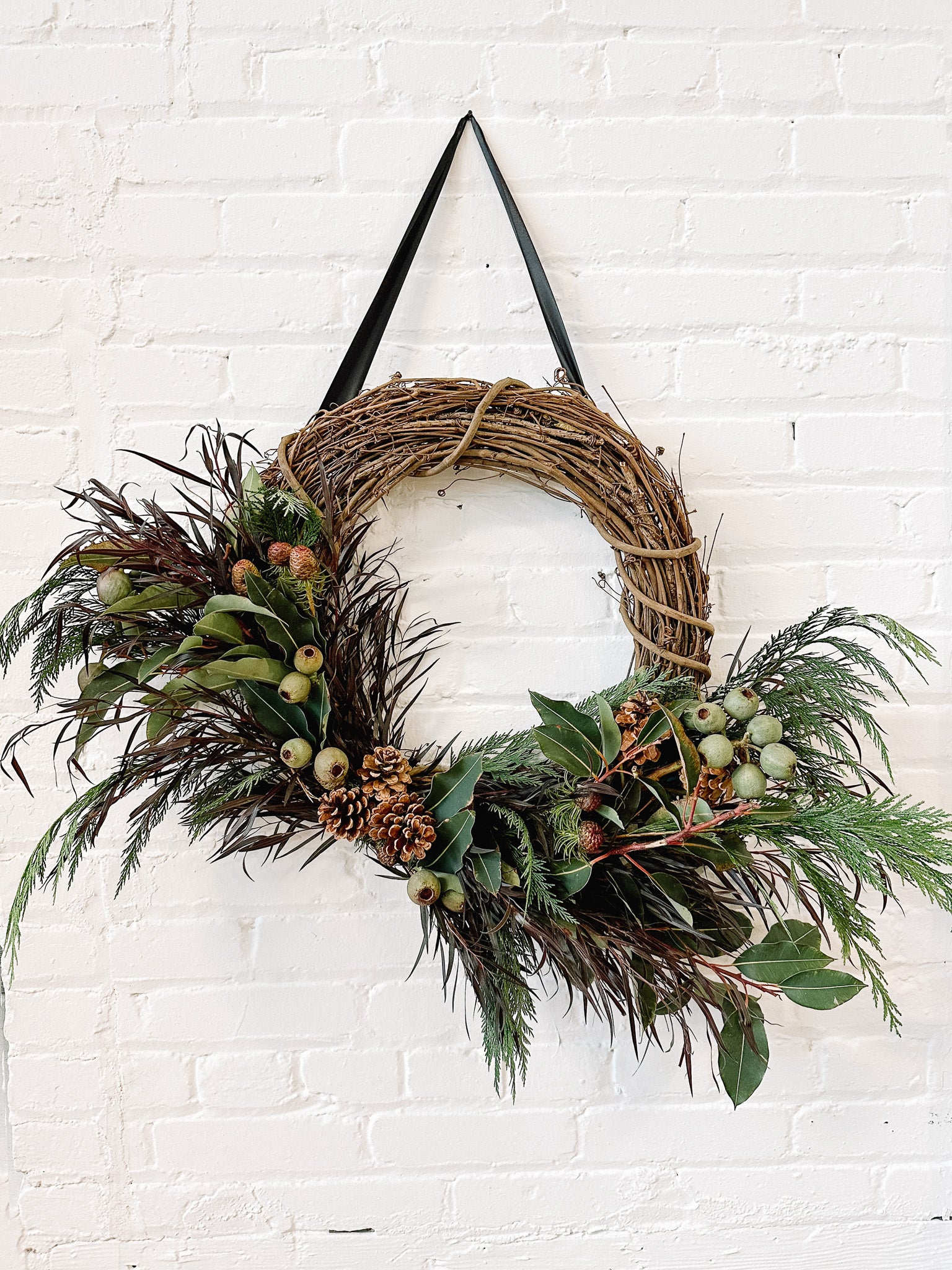 Vine wreath on brick wall