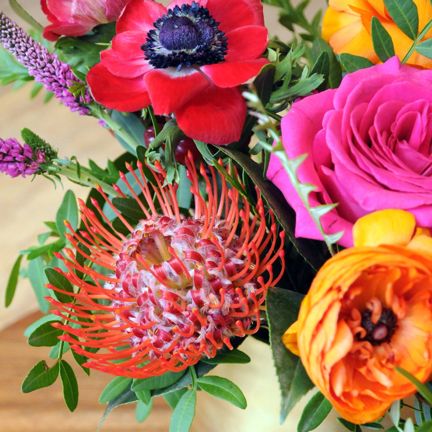 Detailed view of Protea flower and Pink roses