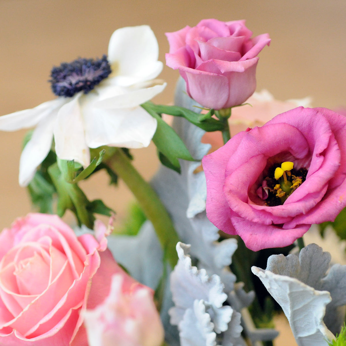 Details view of accent florals in Montrose arrangement from Spruce Flowers