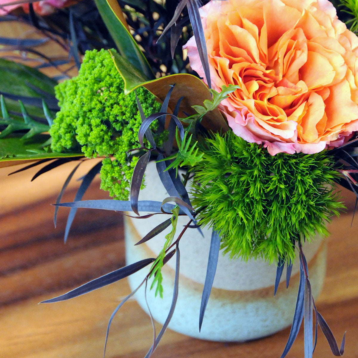 Fluffy Tracillium and green Trick in a floral arrangement
