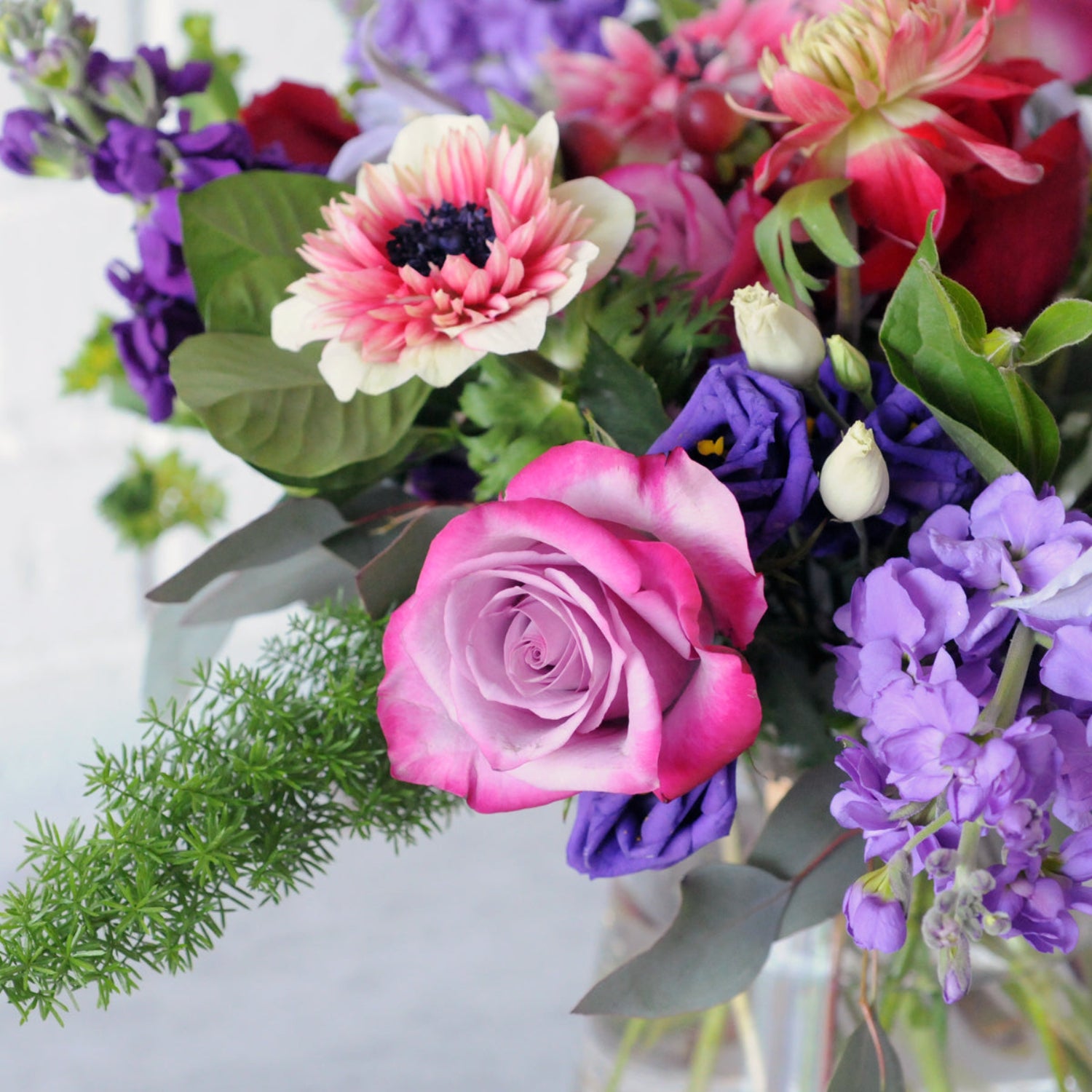 Close up of Aldrich Floral arrangement from Spruce Flowers showing roses Lisianthus Stock and Anemone