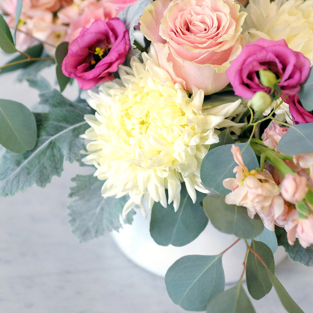 Close detail of the fresh blooms in Spruce Flowers blaisdell arrangement.