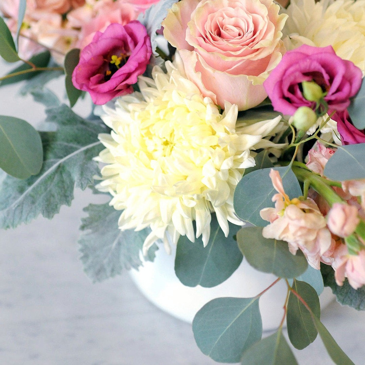Close detail of the fresh blooms in Spruce Flowers blaisdell arrangement.