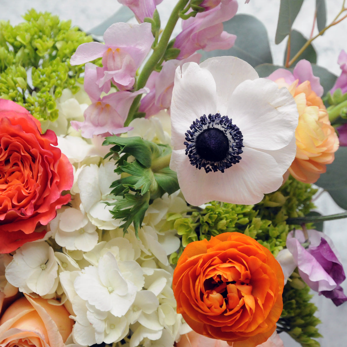 Close up of the assorted blooms featured in the Cheyenne arrangement from Spruce Flowers
