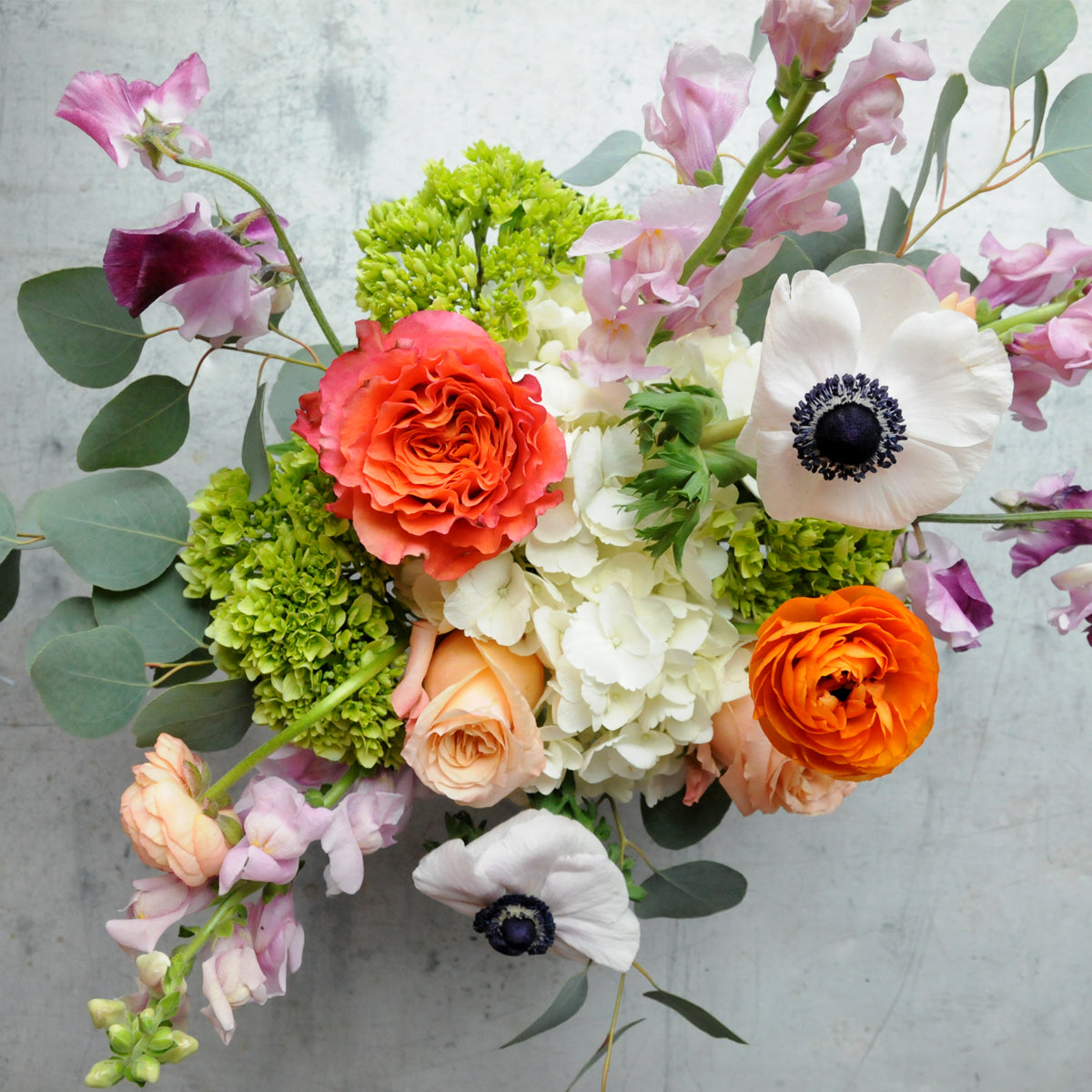 Top down view showing the asymmetric shape of the whimsical Cheyenne floral arrangement