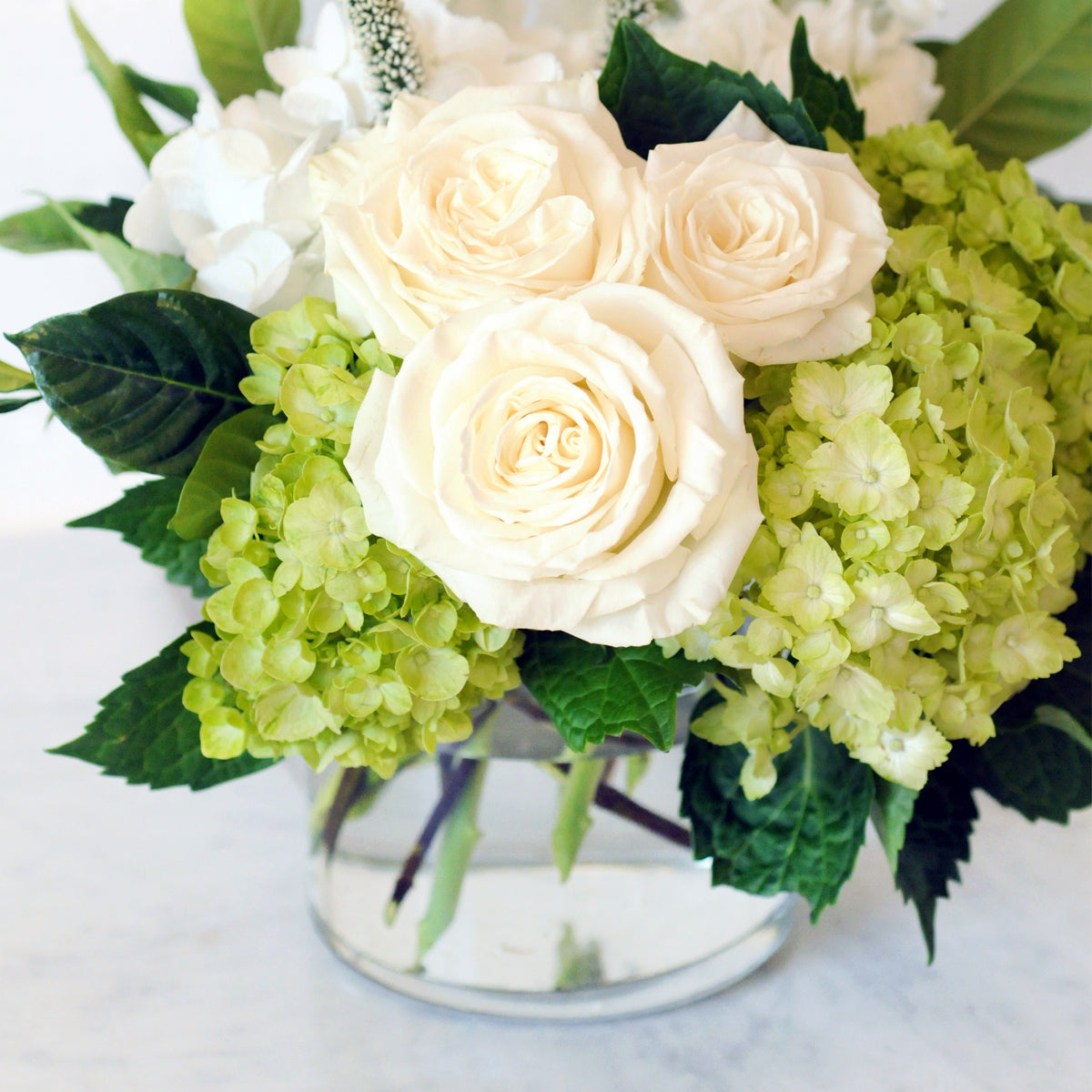 Detailed view showing glass vase and Duke Floral arrangement.