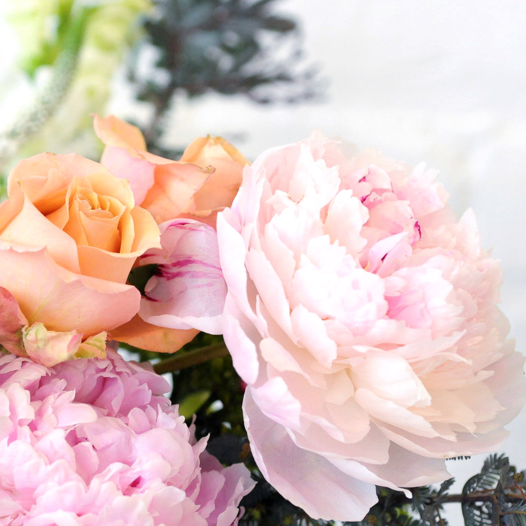 zoom in on Peoney and Spray roses in Victoria Floral arrangement