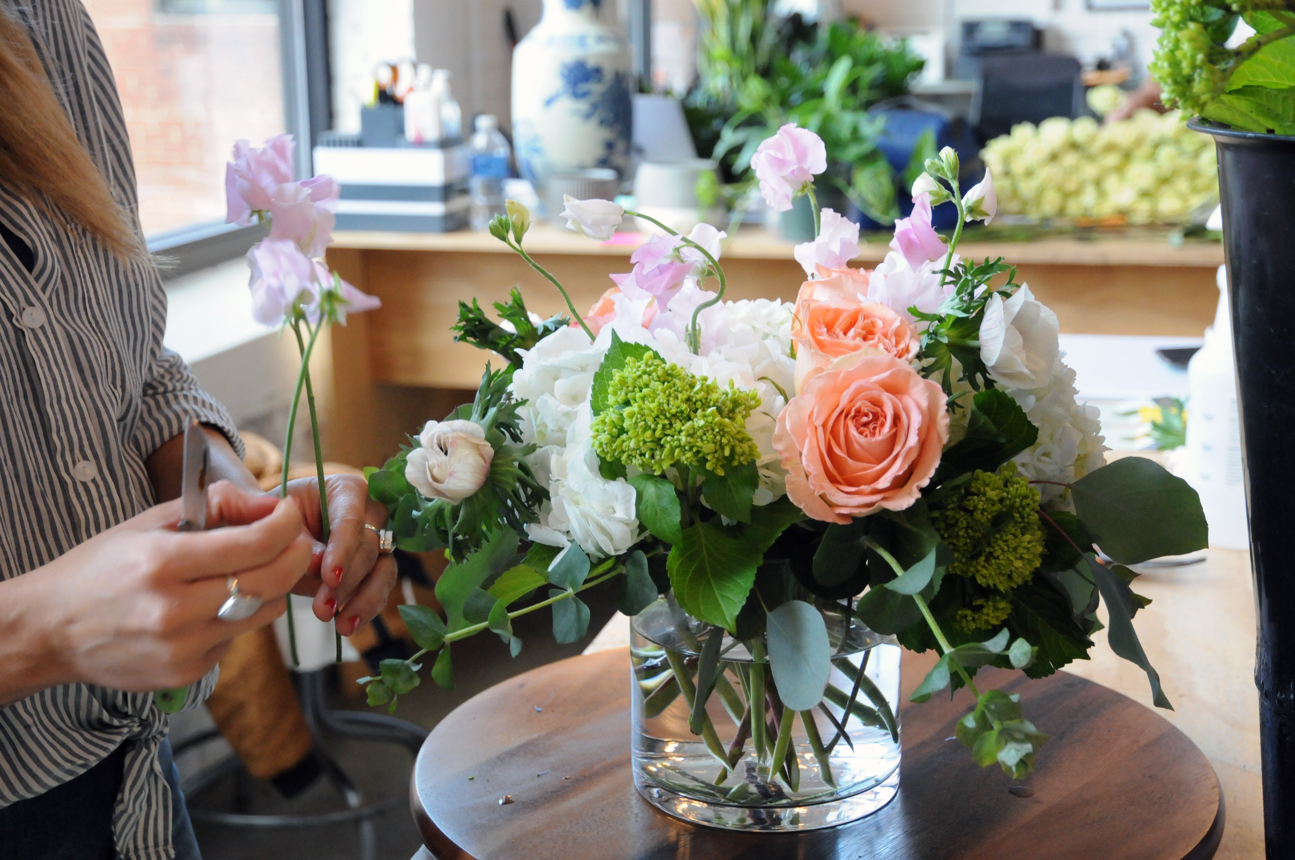 Spruce Designer creating a Floral Arrangement 