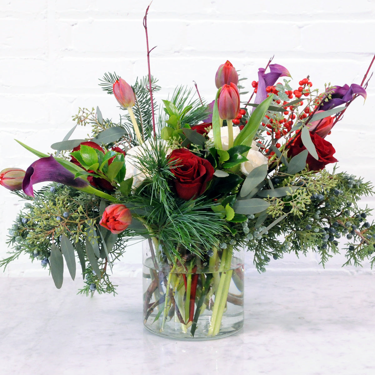 Front view of Spruce Flowers Armatage arrangement in glass vase 