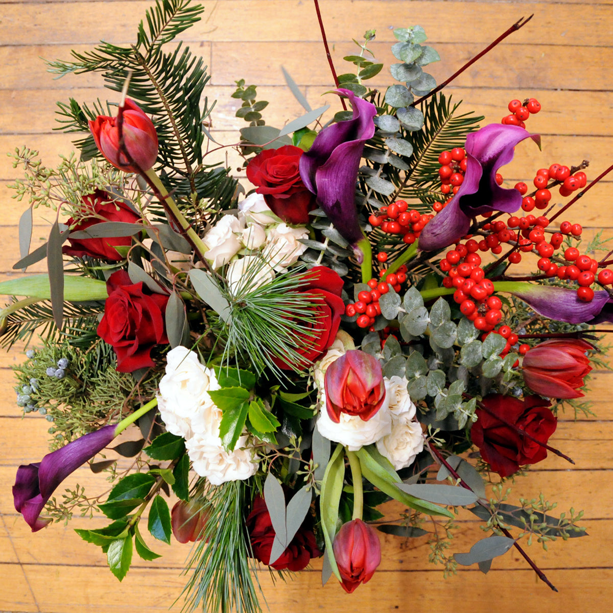Top down view of Armatage floral arrangement showing a high mix of florals and textural foliages 