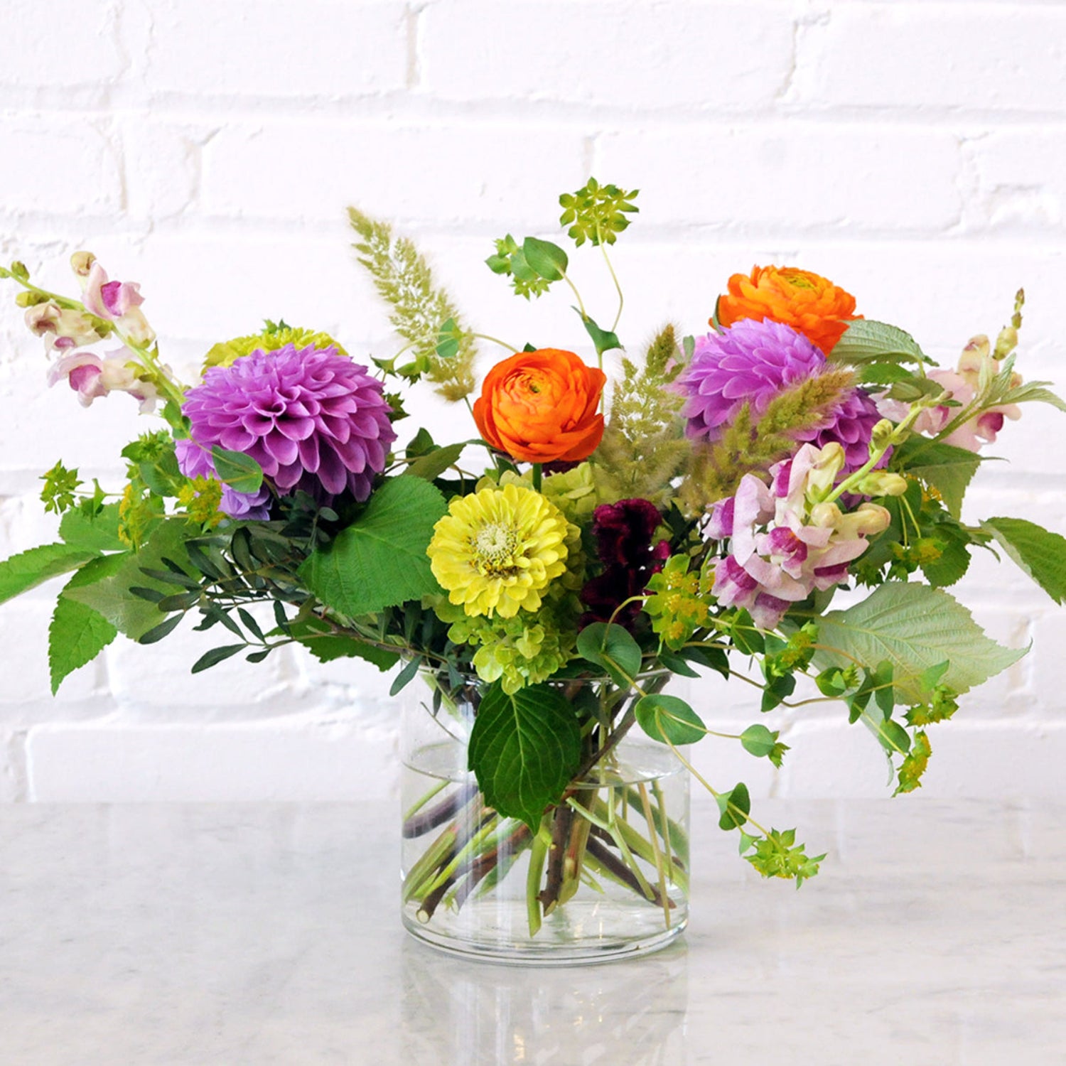 Front view of Buchanan arrangement in purple and orange shades. 