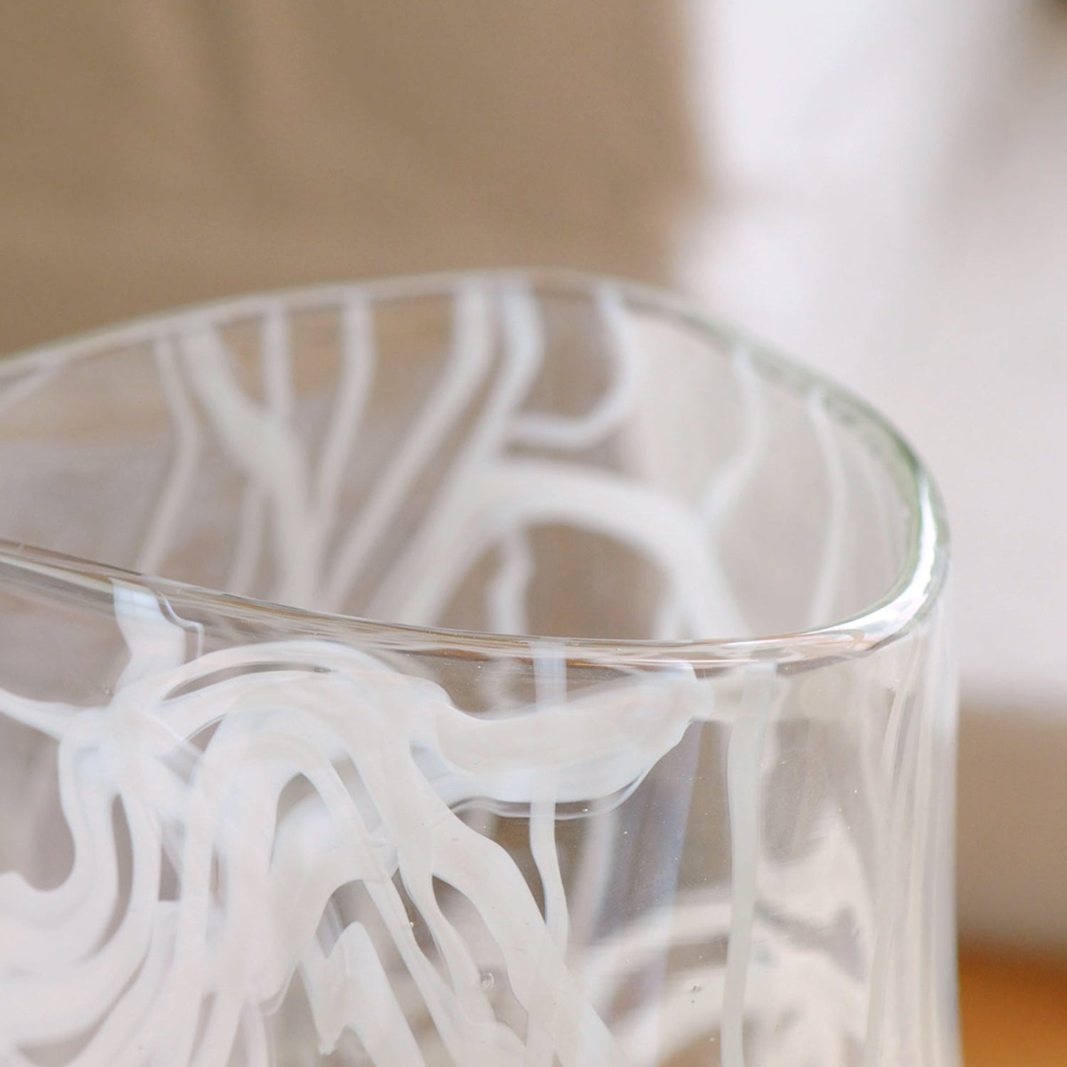 Cirrus Vase - Clear glass with white decorative elements and a rounded triangular shape