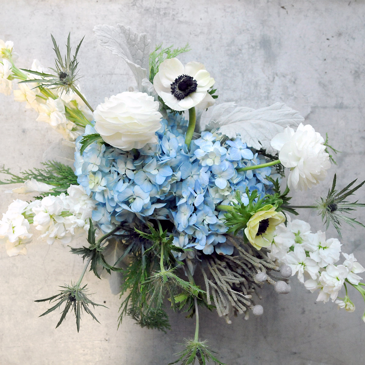 Top down view of arrangement showing it textural florals and classic styling