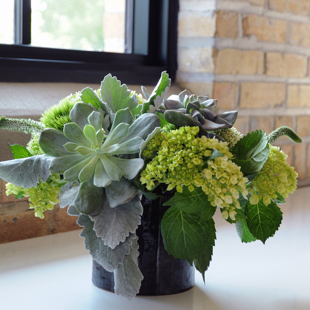 Close up of medium Loring Flower arrangement in a Black Delux Vase. 