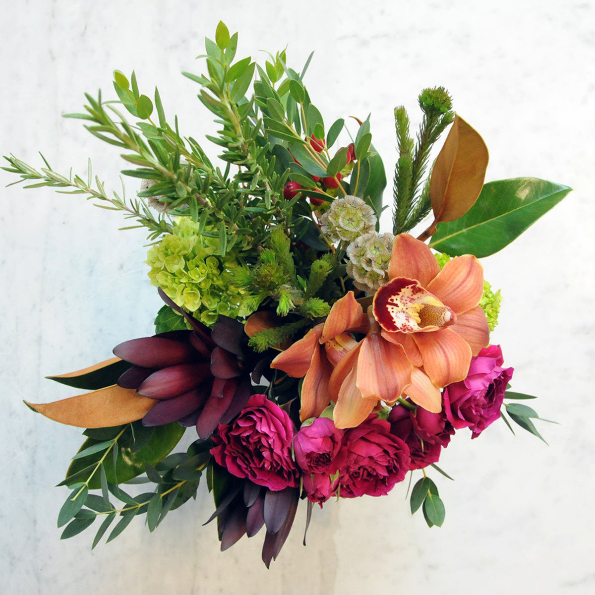 Top down image of Spruce Flowers Lowry arrangement showing its asymmetrical shape fall colors and autumn vibe