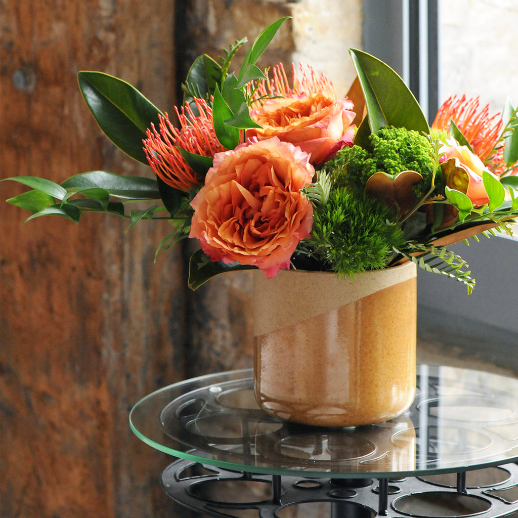 Parkway Floral arrangement shown on Glass table 