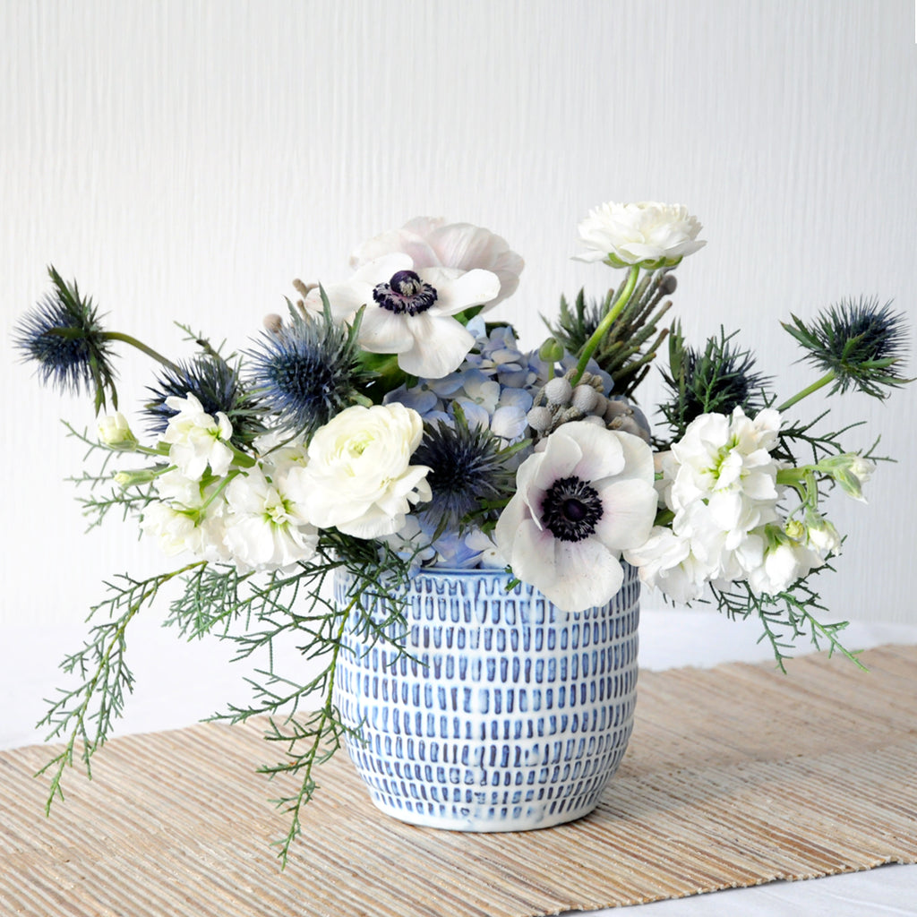 Freemont flower arrangement in subtle white blue tones 