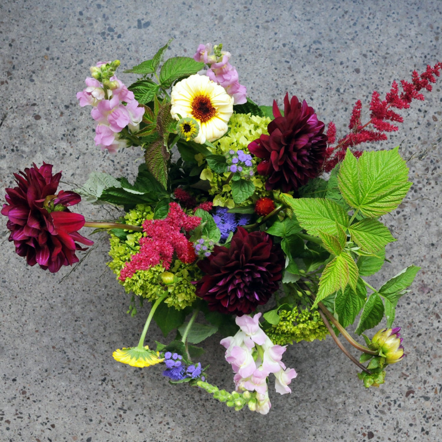 Top down view of Buchanan arrangement in rich Jewel tones with accents of Raspberry
