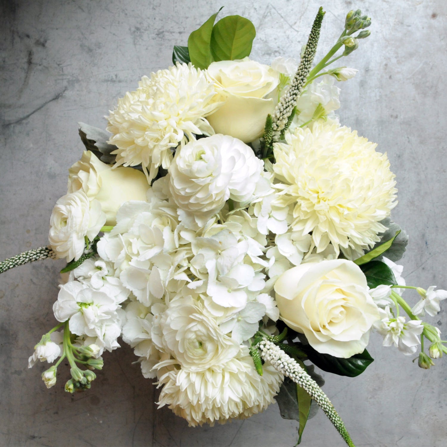 Top down view of our Como arrangement showing the wide breath of white florals