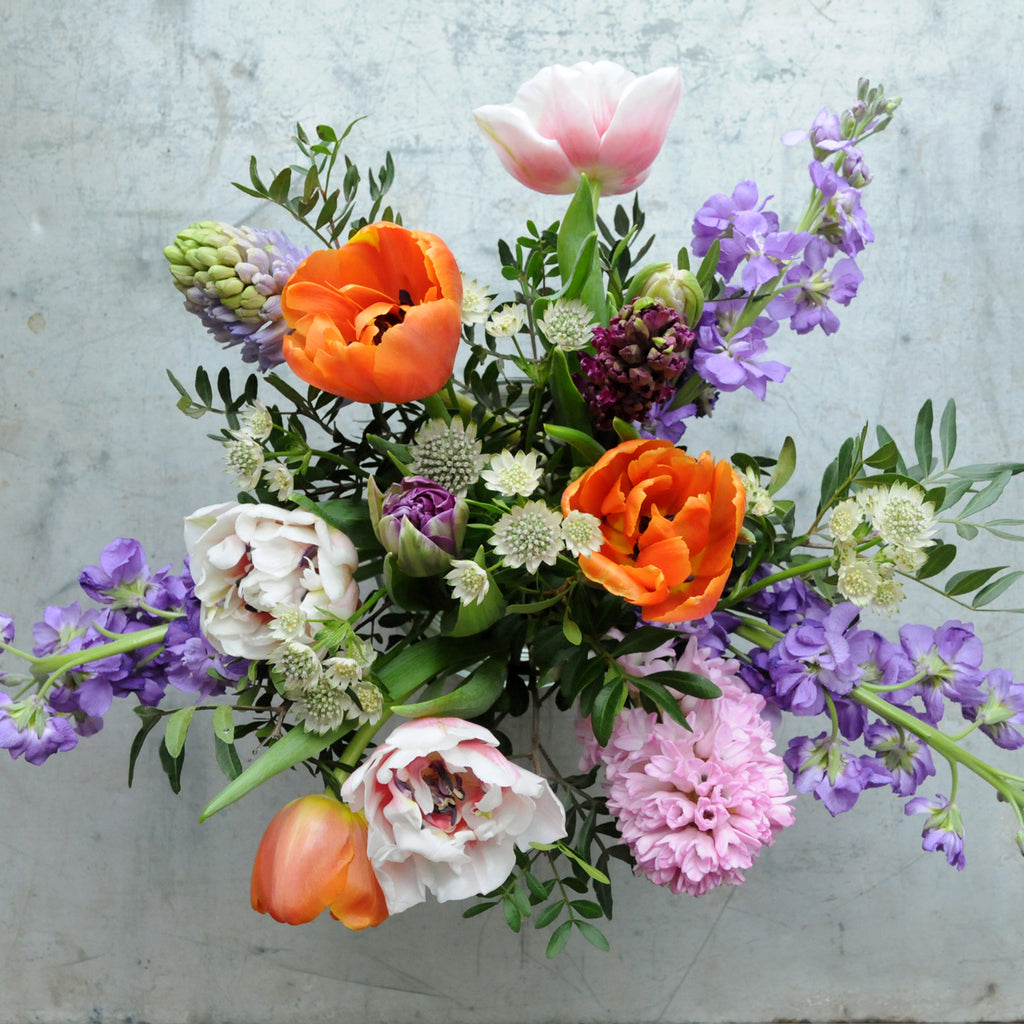 Top down view of the Spring St arrangement from Spruce Flowers a vibrant spring mix of favorites such as tulips and Hyacinth for fresh flower delivery in Minneapolis & St Paul 